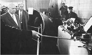 Russian Premier Nikita Kruschev examines wreckage from Gary Powers’ U-2 spy plane (Author unknown)